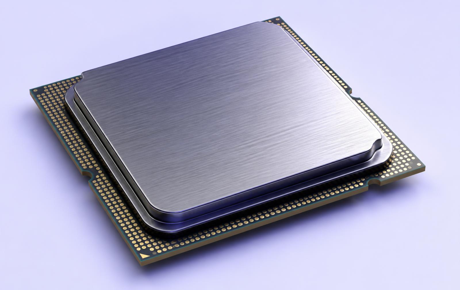 Macro render of a processor package with a brushed metal heat spreader on a pale surface